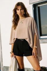 Asymmetrical blouse with shoulder pads