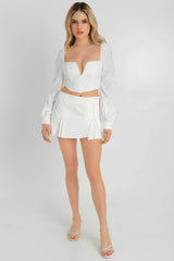 Falda corta con tableado cintura alta