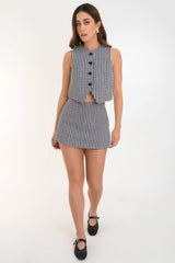 Falda short corto ajustado de pata de gallo