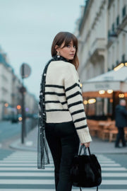 Jersey de punto, estampado rayas, fit oversized, manga larga con rib en puños y cuello redondo.