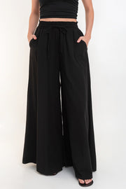 Pantalón fit palazzo cintura alta con jareta