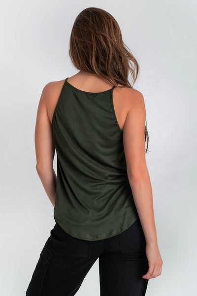 Top de cuello halter sin mangas, tirantes finos, bajo curveado y silueta ligeramente oversized.