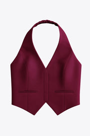 Chaleco corto cuello halter de fit ajustado, escote v, cierre lateral con cremallera oculta, vivos decorativos frontales y bajo v frontal. Escote en espalda y rib elástico posterior.
