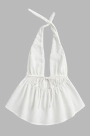 Top de cuello halter con nudo amarrable posterior, escote v con plisados frontales, rib elástico en cintura y peplum olanes. Detalle de escote en espalda con lazo amarrable posterior.