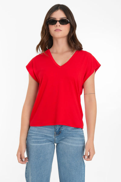 Top de cuello v, fit oversized y manga corta seguida.